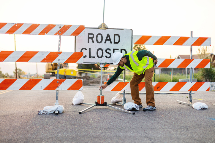Hispanic Workers Setting Barriers and Directing Traffic Street Road and Highway Construction Photo Series