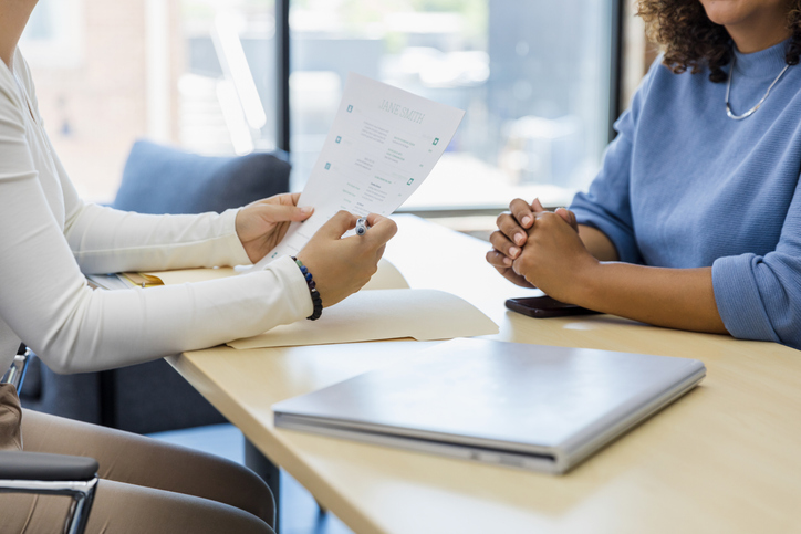 Two people talk about changes to their business plan