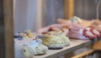 Baby Booties On Shelf For Sale At Store