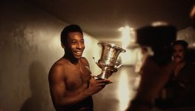 Pelé Of Cosmos Poses With A Trophy