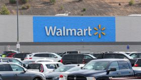 A Walmart logo seen from the parking lot of its store in...