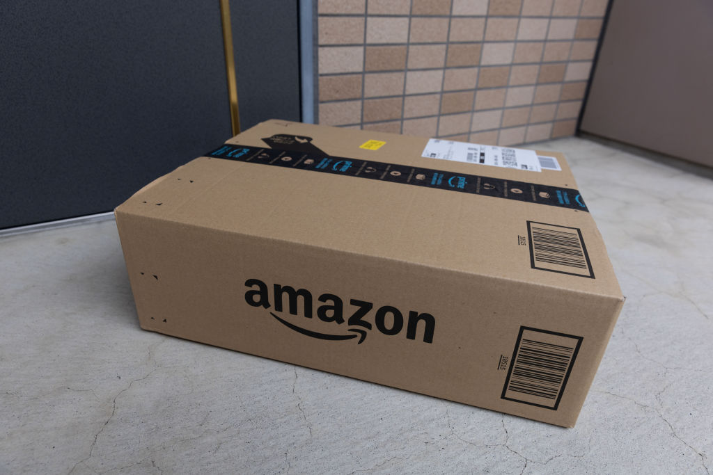 Amazon delivery package seen in front of a door...