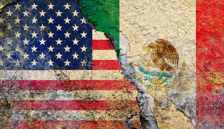 Cracked Wall with United States and Mexico Flags Representing Border Tensions, Immigration Issues, and Bilateral Relations