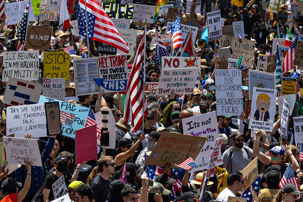 Protesters clash against law enforcement at the "No Kings" Day demonstration in downtown Los Angeles...