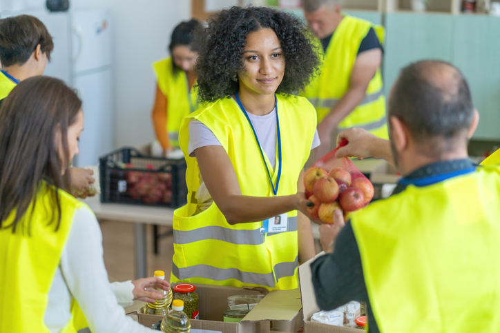 Volunteers preparing food donations for people in need