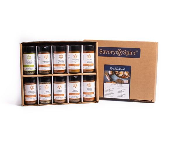A gift box containing various spice jars from the Savory Spice brand.