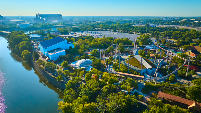 Aerial View of Lively Zoo Park with Fencing and River