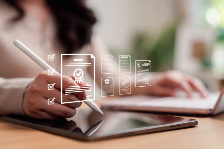Online education and e-learning concept. Woman using stylus on tablet with digital graduation certificate and document icons.